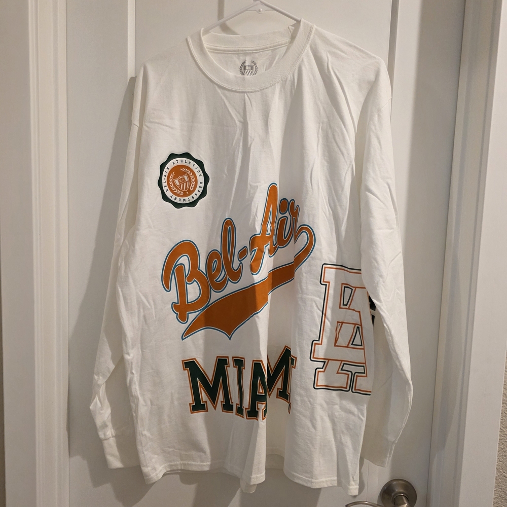 White Long Sleeve Shirt with Orange and Black Graphics